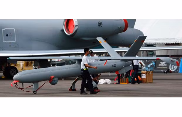 Airmen from the Republic of Singapore Air Force assemble an Elbit Hermes 450 unmanned aerial vehicle (UAV