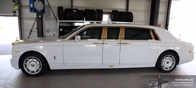 The gold-plated Rolls Royce Phantom, worth more than £5m, has been customised for a businessman in the Middle East Read more: http://www.dailymail.co.uk/sciencetech/article-2113942/A-car-Goldfinger-Grenade-proof-Rolls-Royce-Phantom-covered-inside-precious-metal-sells-5m.html#ixzz1oxreLzsp