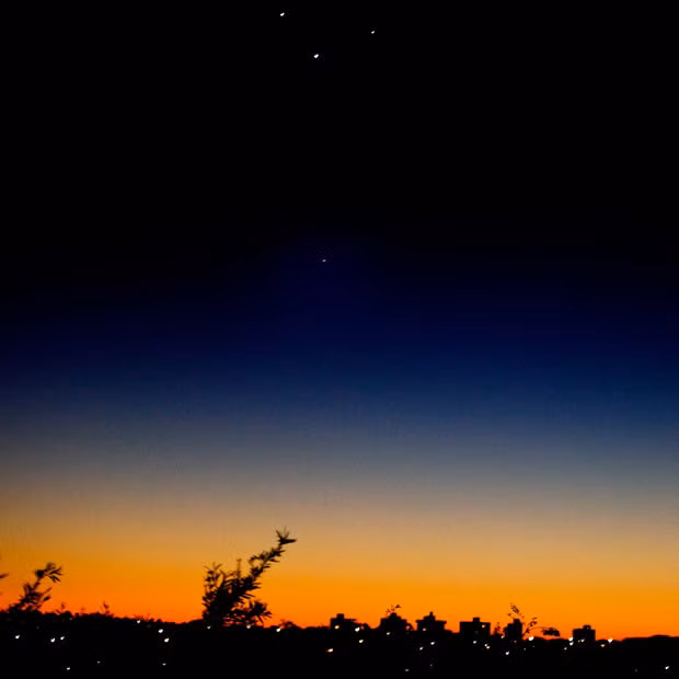 Venus (C), Jupiter (L), Mercury (R) and Mars (bottom) align in the eastern sky during the early sunrise hours over Sydney, Australia. The astronomical phenomenon is unlikely to occur again before 2040.