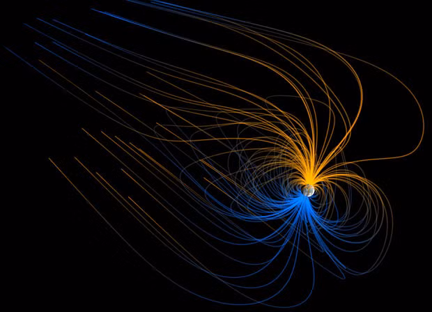 This image released by the Nasa Earth Observatory is a visualisation of the magnetic field around Earth - the magnetosphere - as it might look from space. The orange and blue lines depict the opposite north and south polarity of Earth’s field lines. The field lines are not actually visible, but they can be detected by sensors that count atomic particles - protons and electrons moving in the space around Earth. Unlike the symmetrical pattern of iron filings around a magnet, the magnetosphere is pushed in on the side facing the Sun and stretched out in the Earth’s wake. This is caused by the solar wind, a stream of high-speed particles flowing out from the Sun and carrying the signatures of its own magnetic field.