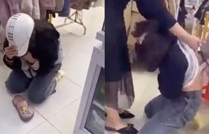 Hình ảnh một nữ sinh bị hành hạ tại shop quần áo nghi do lấy trộm đồ.