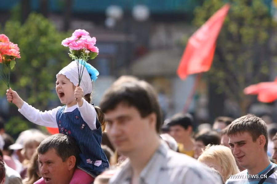 A child attends a rally marking May Day in Kiev, Ukraine, on May 1, 2013. Over 15,000 Ukrainian Communists held a rally marking May Day in the center of Kiev. (Xinhua/Mu Liming)