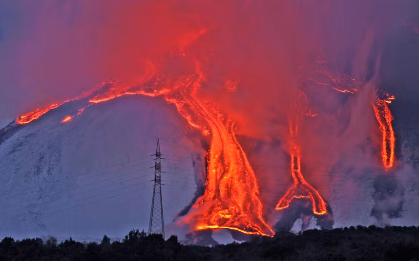 Lava flows down the flanks of Mount Etna in Sicily
