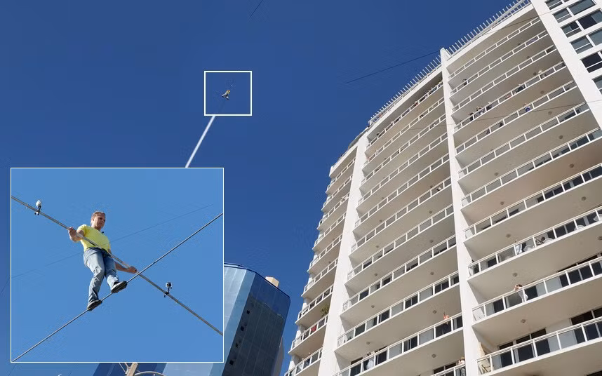 Nik Wallenda walks from a crane to the Marina Tower on a wire, 200 feet in the air in Sarasota, Florida. Wallenda did not have a harness or net for the 600 foot skywalk.