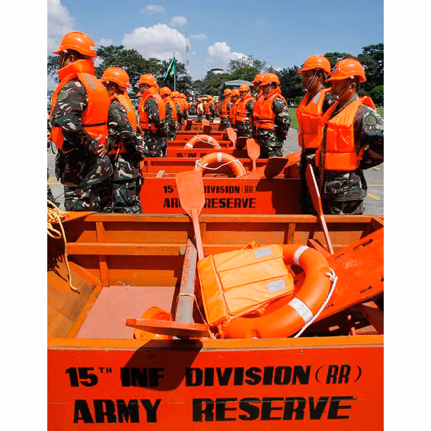 Lụt lội ở Philippines, Thái Lan và Việt Nam trước sức mạnh của Megi ảnh 17 Military rescuers stand beside life-saving equipment as Typhoon Megi approaches during an inspection at Camp Aguinaldo in Quezon City