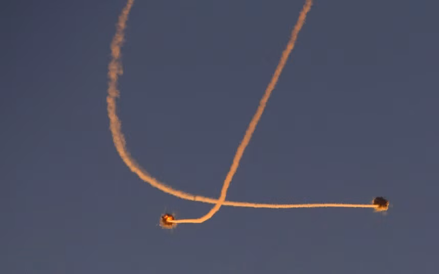 Smoke trails are seen as an Israeli Iron Dome defence missile intercepts a rocket which was launched from Gaza, near the southern town of Sderot