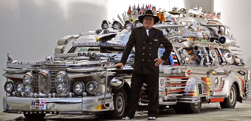 Finne Antti Rahko stands next to his self-made Finnjet during preparations for the Essen Motor Show in Essen, western Germany. The vehicle, with eight wheels and ten seats, weighs 3.4 tons. 