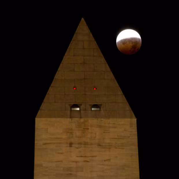 This NASA photograph shows the lunar eclipse behind the Washington Monument 