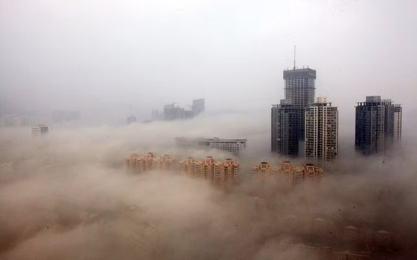Buildings are shrouded in smog on in China. Heavy smog has been lingering in northern and eastern parts of China since last week, disturbing the traffic, worsening air pollution and forcing the closure of schools