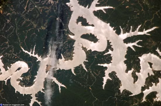 Beaver Lake in Arkansas USA Beaver Lake, a man-made reservoir, completed in 1966 and nestled high in the Ozark Mountains, is located in northwest Arkansas, the birthplace of the White River. Even if man-made lakes sometimes are destructive to wildlife, it is still pretty impressive how mankind can shape our planet. 