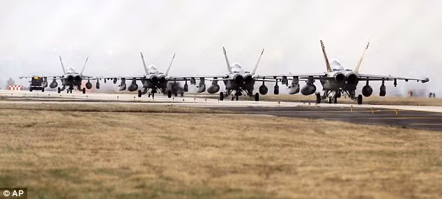 F-18 fighters are parked at the NATO airbase in Aviano, Italy. International leaders have said Libya could face military action if it refuses to comply with UN resolution Read more: http://www.dailymail.co.uk/news/article-1367800/Libya-Rebels-shoot-fighter-jet-Gaddafis-forces-break-ceasefire.html#ixzz1H3rbNdTV