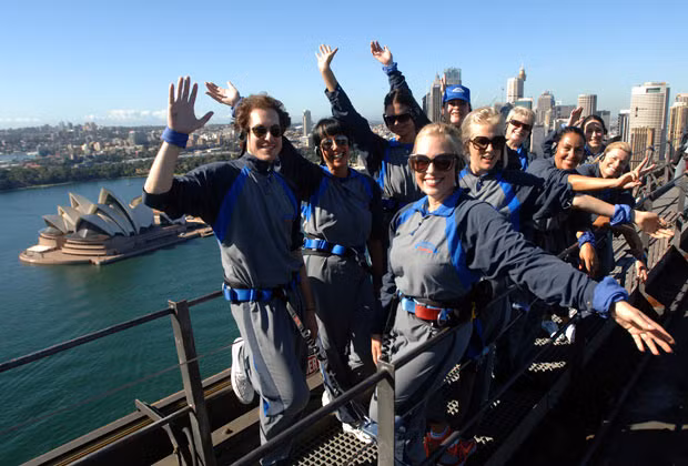 Women celebrate the 100th anniversary of International Women’s Day by climbing the Sydney Harbour Bridge