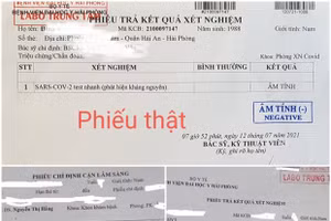 Kết quả xét nghiệm thật của Bệnh viện Đại học Y Hải Phòng (phía trên) và kết quả xét nghiệm giả mạo Bệnh viện Đại học Y Hải Phòng (phía dưới). Ảnh: TTXVN.