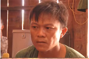 Phàn Xuân Dũng cùng tang vật của vụ án. Ảnh: Công an Lai Châu.