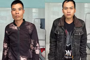 Hà Viết Võ (trái) và Hoàng Ngọc Oai tại cơ quan chức năng. 