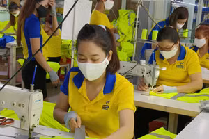 Nhiều DN dệt may đã nhận đơn hàng đến hết quý III năm nay. Ảnh: Quốc Hải