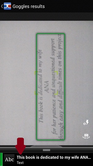 Dịch văn bản qua hình ảnh chụp bằng Google Goggles: Google Goggles sẽ quét ảnh và đóng khung những gì nhận diện được. Những gì nhận diện được cũng sẽ được hiển thị phía dưới (mũi tên), hãy bấm vào đó. E4,5-Google-Goggles-Dich-van-ban-qua-hinh-anh-chup-Nhan-dien-text.jpg