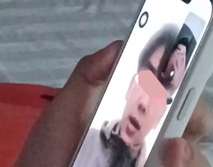 Ảnh cắt từ clip em H. gọi về cho gia đình. Ảnh: CACC.