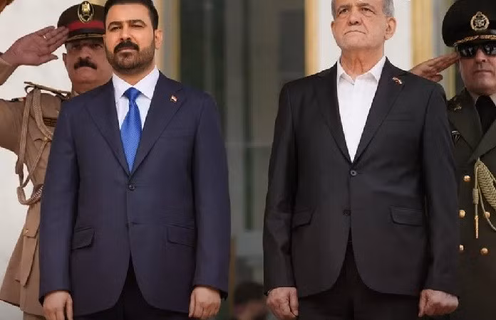 Thủ tướng Iraq Ali Al-Zaidi (trái) và Tổng thống Iran Masoud Pezeshkian.