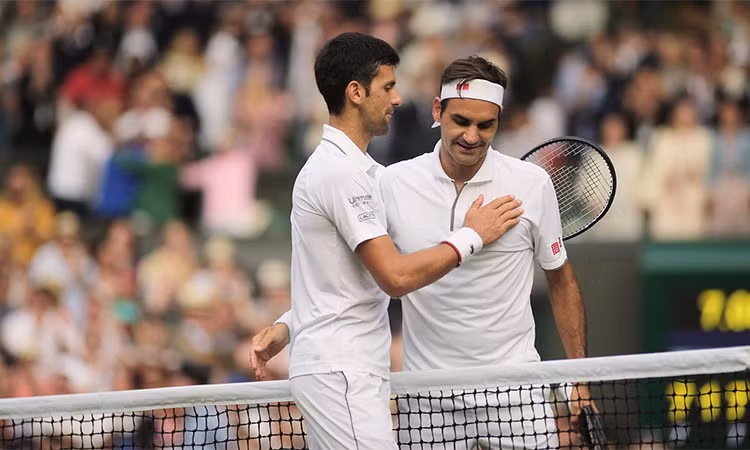 Federer (phải) lỡ cơ hội đoạt Grand Slam thứ 21