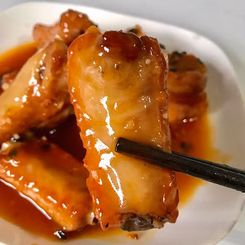 Đổi món với sườn sốt chanh leo vừa ngon vừa đẹp ảnh 1 Món sườn sốt chanh leo thành phẩm. Ảnh: Chang Nguyen