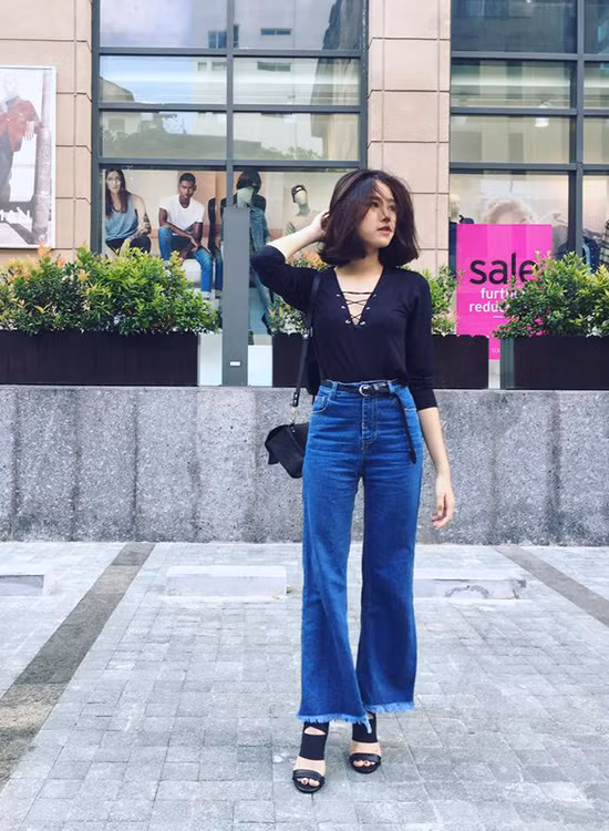 Quần jeans lửng xé gấu được hot girl Diệu Ly diện theo phong cách sang chảnh. gioi-tre-viet-sot-mot-jeans-lung-lo-kieu-han-7