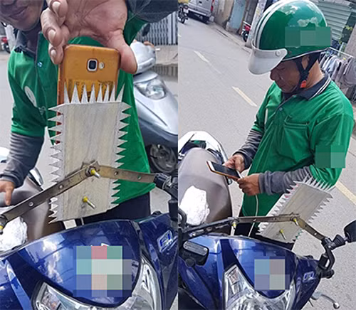 Người đàn ông lấy bìa cát tông cắt thành những gai nhọn rồi gắn vào khung sắt để các tên cướp bỏ ý định giật điện thoại.