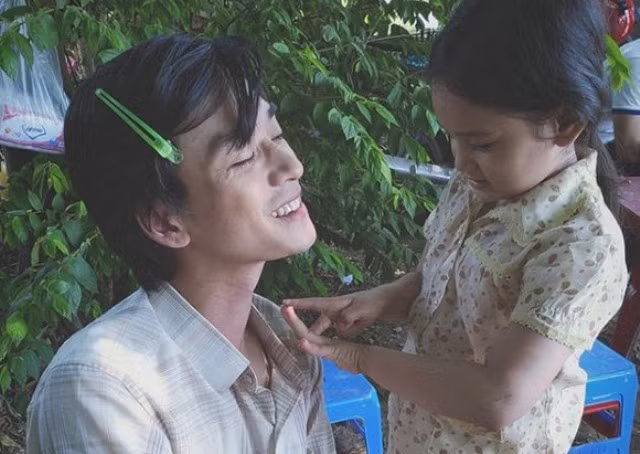 Trần Nghĩa và bé Trà Long.