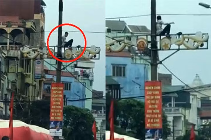 Nam thanh niên nghi ngáo đá ngồi vắt vẻo trên cột điện