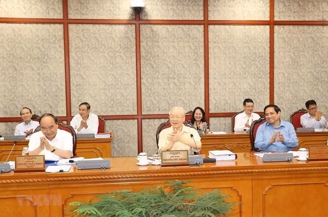 Tổng Bí thư Nguyễn Phú Trọng, Chủ tịch nước Nguyễn Xuân Phúc và Thủ tướng Phạm Minh Chính tại cuộc họp - Ảnh: TTTXVN.