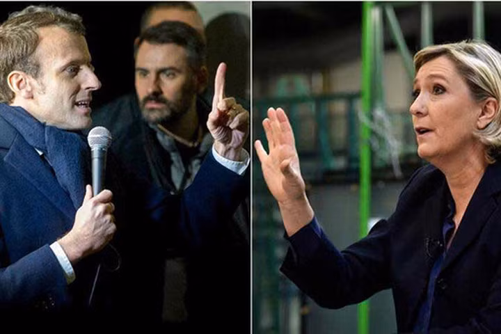Hai ứng viên tổng thống Pháp Marine Le Pen (phải) và Emmanuel Macron Ảnh: LE FIGARO 