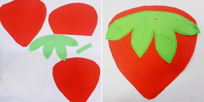 Cắt vải cotton đỏ thành 2 tấm làm quả dâu tây và 1 tấm 2/3 trái dâu tây. Cắt vải nỉ màu trắng làm vải lót, vải nỉ màu xanh làm cuống dâu tây. Đặt cuống dâu tây màu xanh lên trên 1 tấm dâu tây màu đỏ khâu viền xung quanh. Lưu ý: phần cuống dâu màu xanh hai bên gần mép vải đỏ không khâu để lộn mặt phải ra ngoài. Cắt vải cotton đỏ thành 2 tấm làm quả dâu tây và 1 tấm 2/3 trái dâu tây. Cắt vải nỉ màu trắng làm vải lót, vải nỉ màu xanh làm cuống dâu tây. Đặt cuống dâu tây màu xanh lên trên 1 tấm dâu tây màu đỏ khâu viền xung quanh. Lưu ý: phần cuống dâu màu xanh hai bên gần mép vải đỏ không khâu để lộn mặt phải ra ngoài.