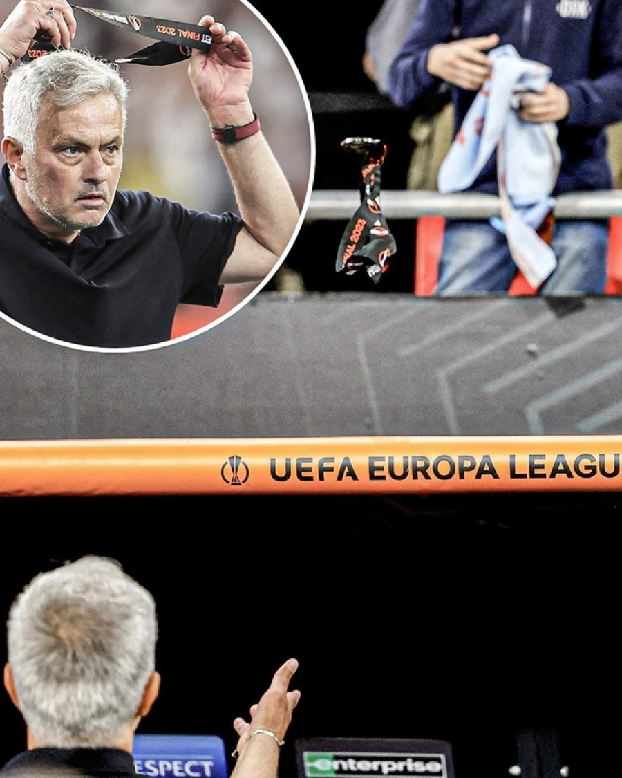 Chiến lược gia Mourinho cởi huy chương Europa League và ném lên khán đài.