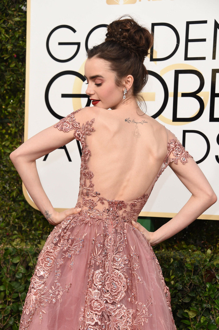 Lily Collins: Nữ diễn viên trẻ và xinh đẹp này xứng đáng là nàng công chúa trong truyện cổ tích khi diện chiếc váy hở lưng đầy tinh tế của nhà thiết kế Zuhair Murad tới Quả cầu vàng.
