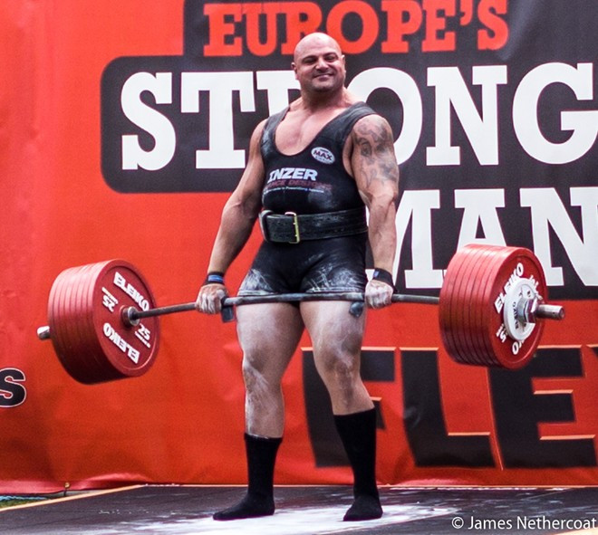 Shahlaei sinh tại Swindon, Anh. Lực sĩ 32 tuổi từng là người đàn ông khỏe nhất Vương quốc Anh năm 2012 và 2013. Tại cuộc thi Người đàn ông khỏe nhất thế giới 2014 (WSM 2014), Shahlaei đứng thứ 10 với 25,5 điểm. Shahlaei sinh tại Swindon, Anh. Lực sĩ 32 tuổi từng là người đàn ông khỏe nhất Vương quốc Anh năm 2012 và 2013. Tại cuộc thi Người đàn ông khỏe nhất thế giới 2014, Shahlaei đứng thứ 10 với 25,5 điểm.