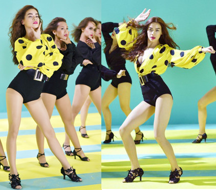 Phong cách cổ điển thể hiện trong thiết kế chấm bị với thắt lưng bản lớn, tôn đôi chân dài của Hồ Ngọc Hà. 5-ly-do-khien-mv-what-is-lo-8085-1439614