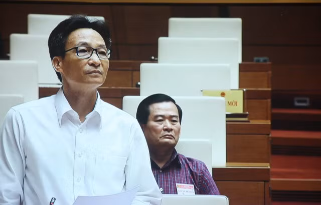 Phó Thủ tướng Vũ Đức Đam trả lời trước Quốc hội sáng nay (6/6).