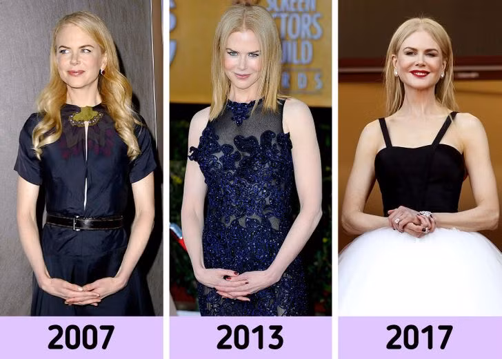 Nicole Kidman đặt tay lên bụng một cách nền nã.