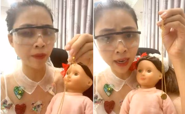 Hình ảnh Thơ Nguyễn ôm búp bê trong clip xin vía học giỏi cho các em học sinh.