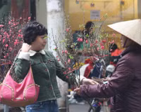 Chùm ảnh: Chợ hoa nổi tiếng nhất Hà Nội ngày giáp Tết - Ảnh 13