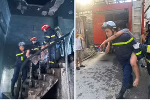 Lực lượng chức năng chữa cháy và cứu hộ nạn nhân.