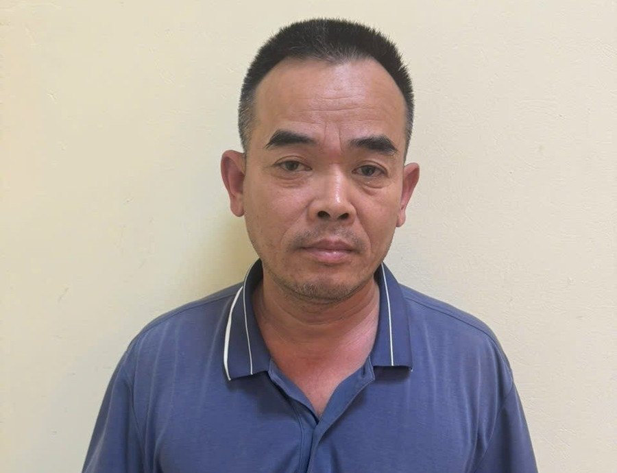 Đinh Văn Long tại cơ quan công an. Ảnh: TG