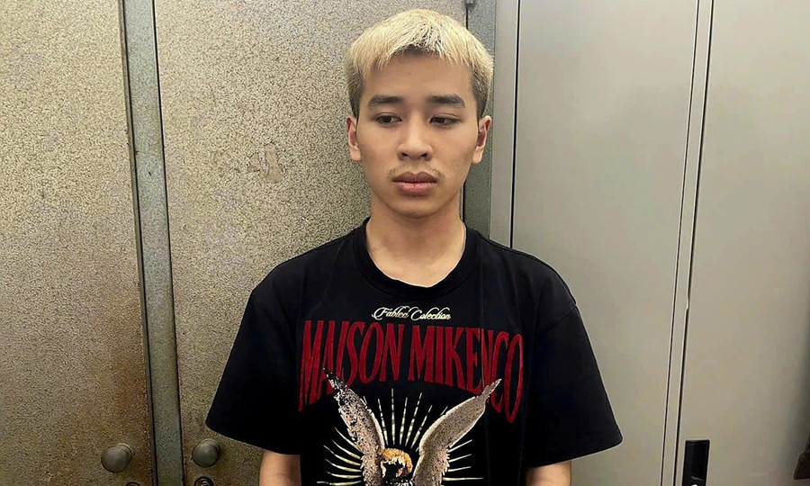 Thân Văn Nam tại cơ quan công an.