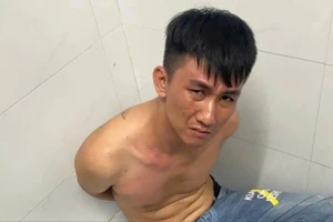 Nguyễn Minh Tâm, nghi phạm đâm tử vong bảo vệ bệnh viện lúc bị bắt giữ.