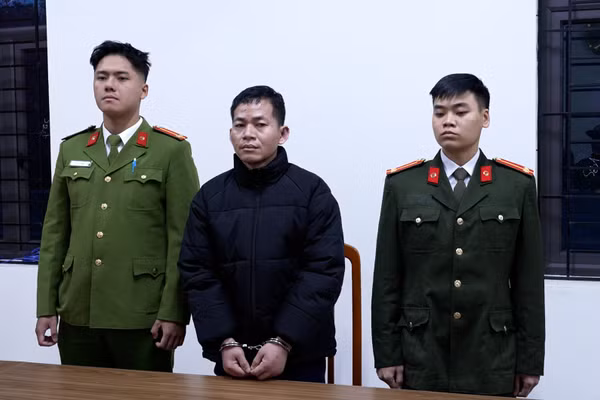 Bị can Trần Quốc Tín tại cơ quan công an.