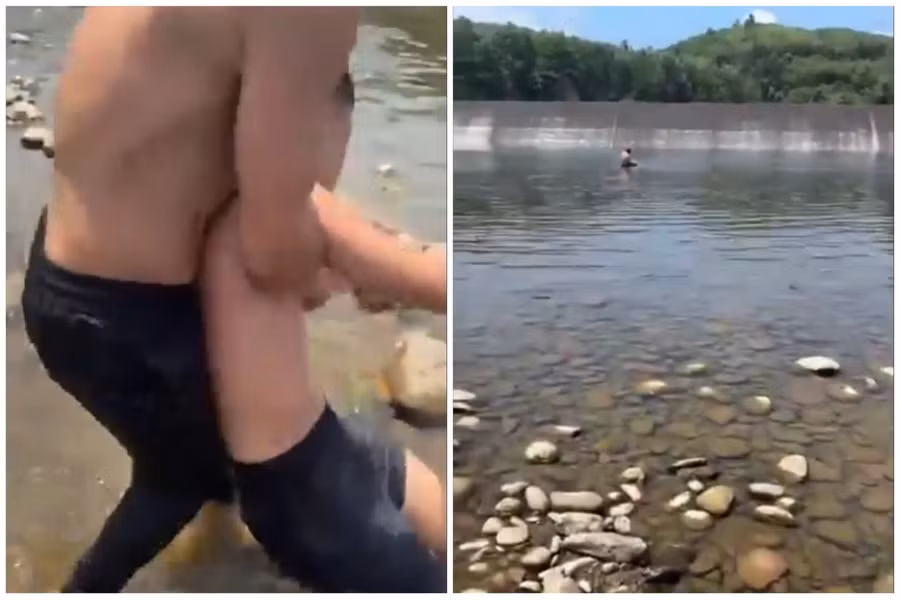 Nam sinh may mắn được cứu sống khi chới với dưới chân đập. (Ảnh cắt từ clip)