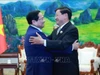 Thủ tướng Phạm Minh Chính hội kiến Tổng Bí thư, Chủ tịch nước Lào Thongloun Sisoulith. Ảnh: Dương Giang/TTXVN