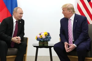 Tổng thống đắc cử Mỹ Donald Trump (phải) và Tổng thống Nga Vladimir Putin.