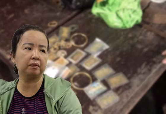 Nguyễn Thị Thu cùng tang vật của vụ án. 