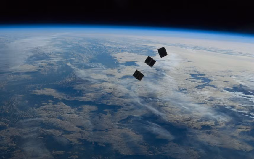 Several tiny satellites are seen shortly after launch in this photograph taken by a crew member on the International Space Station. The satellites were released outside the Kibo laboratory using a Small Satellite Orbital Deployer attached to the Japanese module’s robotic arm.